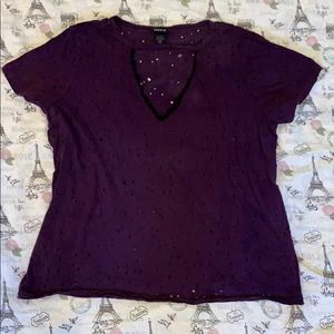 Purple top with lace. Mini cuts all over the top.